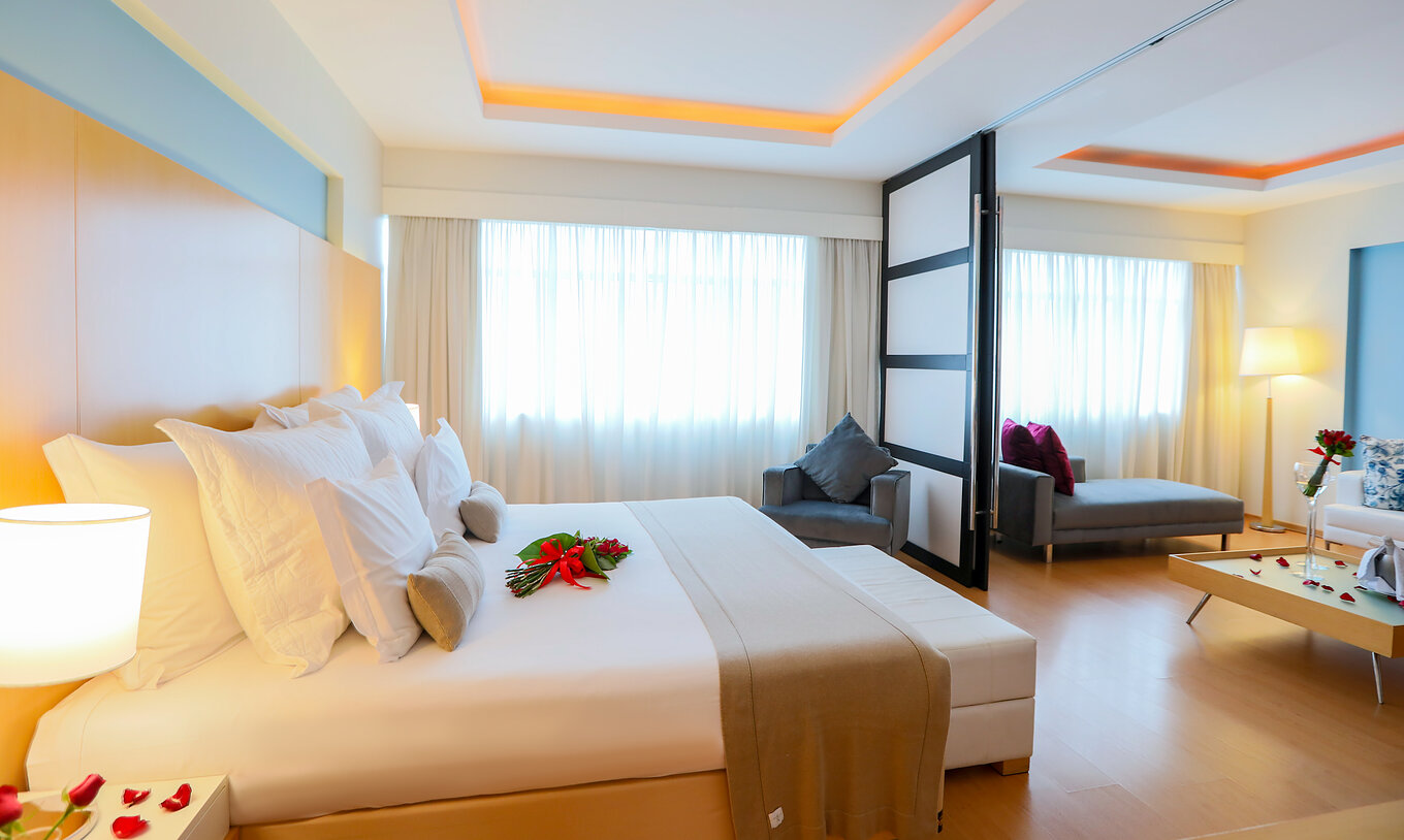 The Suite Master at Pestana Curitiba has a room with a double bed and a living room with a sofa that can be an extra bed