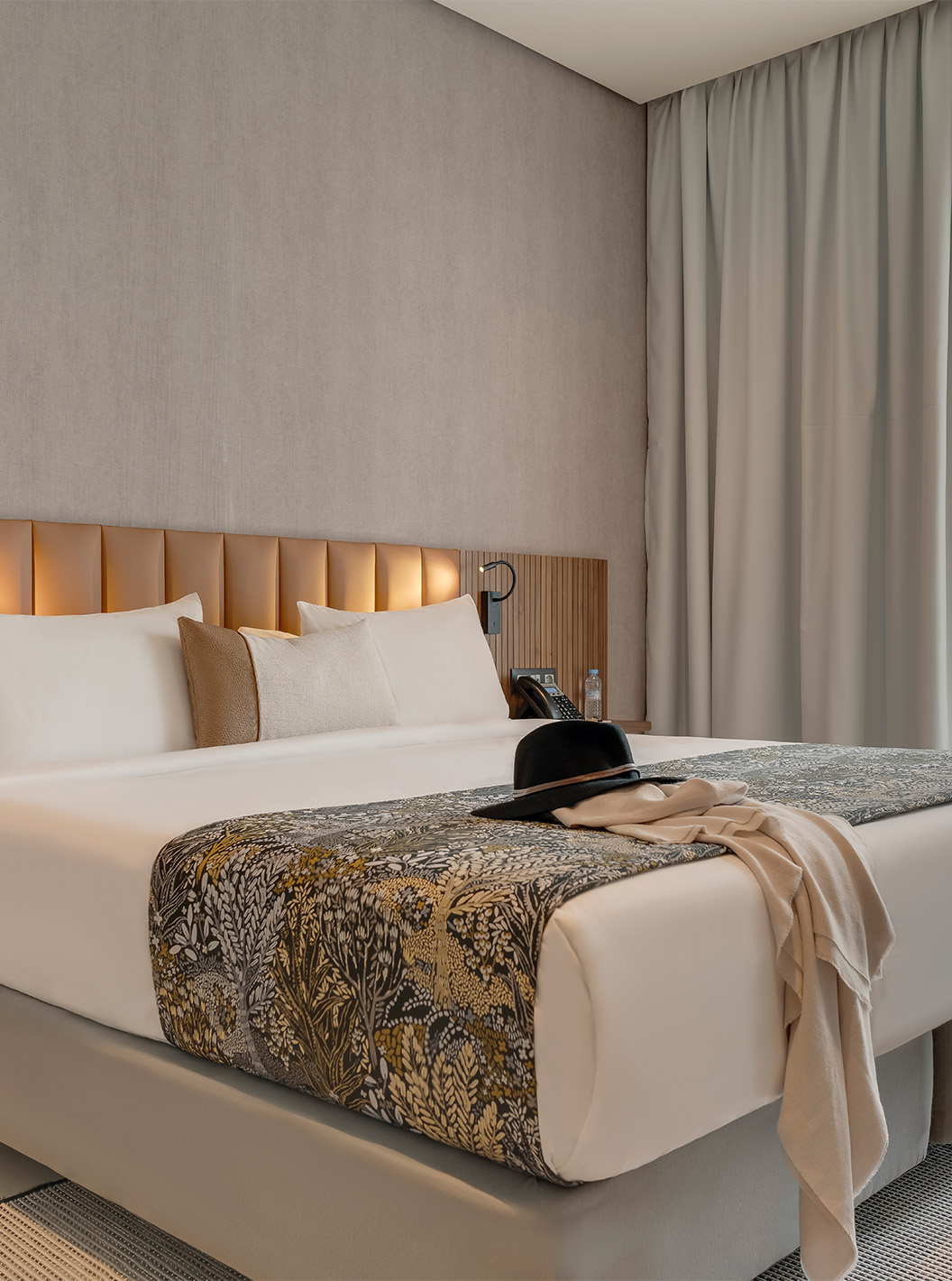 The Suite at Pestana Casablanca has a bedroom with a double bed and a modern, sober decor