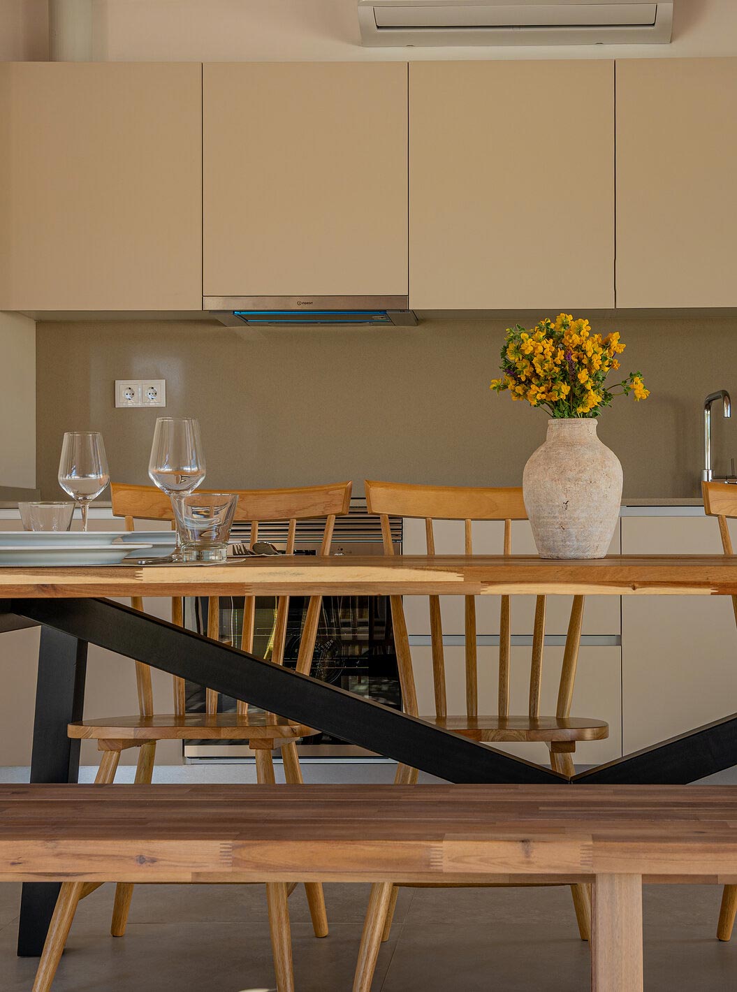 The Premium Villa at Pestana Comporta Village Residences has a modern kitchen with a wooden table and an oven