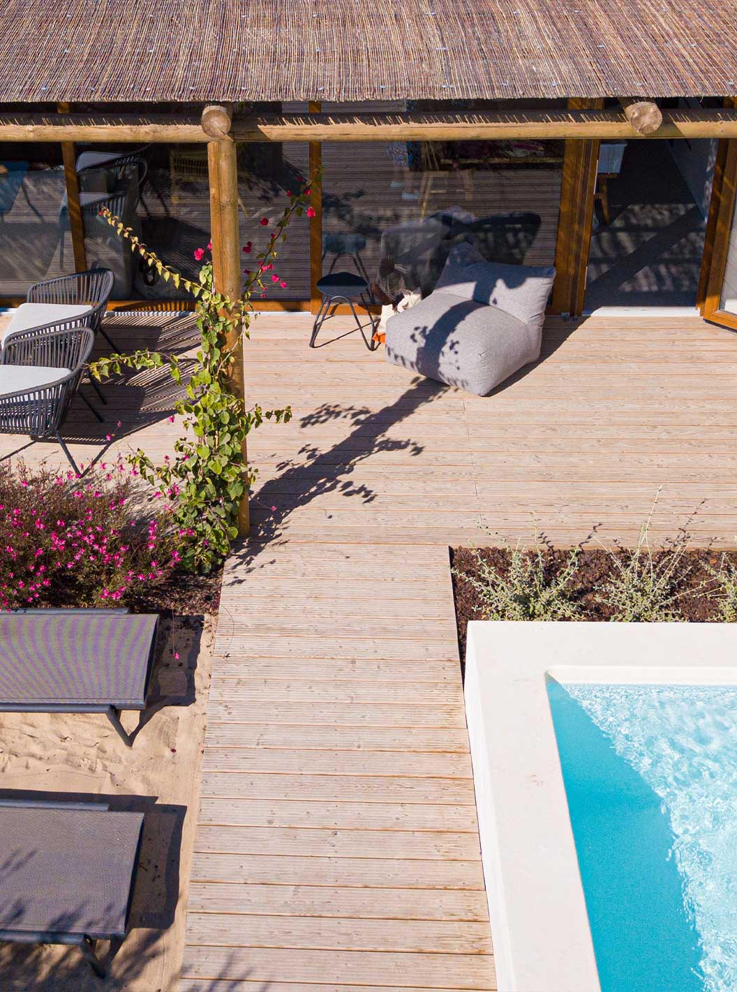 The Standard Villa T2 at Pestana Comporta Village Residences has a terrace with a pool, sun loungers, and plants