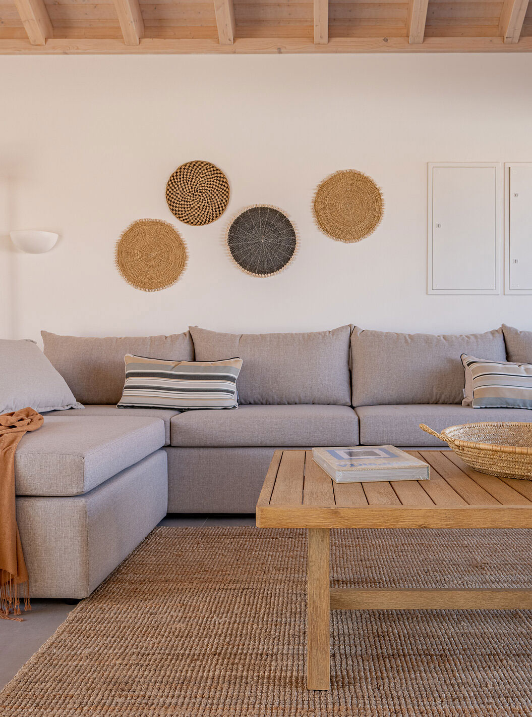 The Superior Villa at Pestana Comporta Village Residences has a living room with a gray sofa and a table