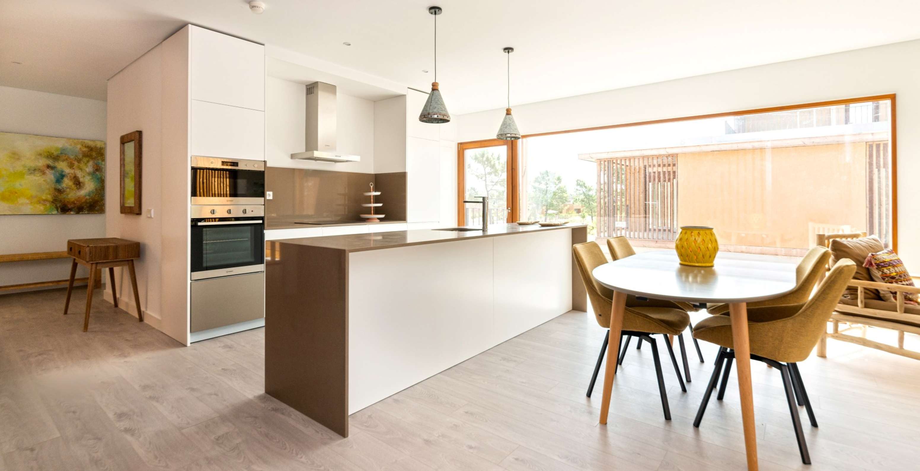 The Eco Village Apartment 1st Floor Views of Pestana Tróia Eco Resort has a kitchen with countertop and a table with chairs