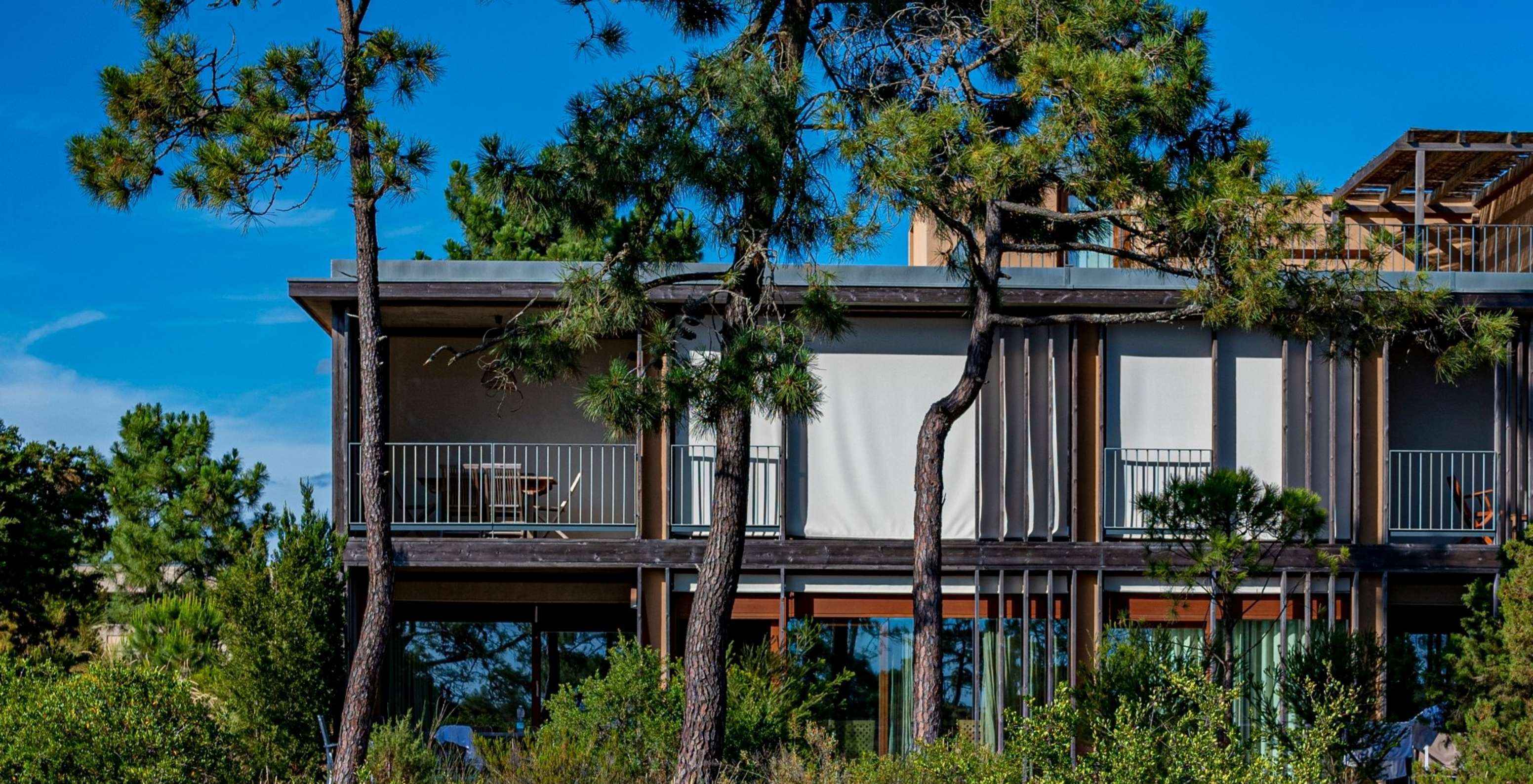 The Eco Village Superior Apartment 1st Floor Premium Views of Pestana Tróia Eco Resort has trees around the villa