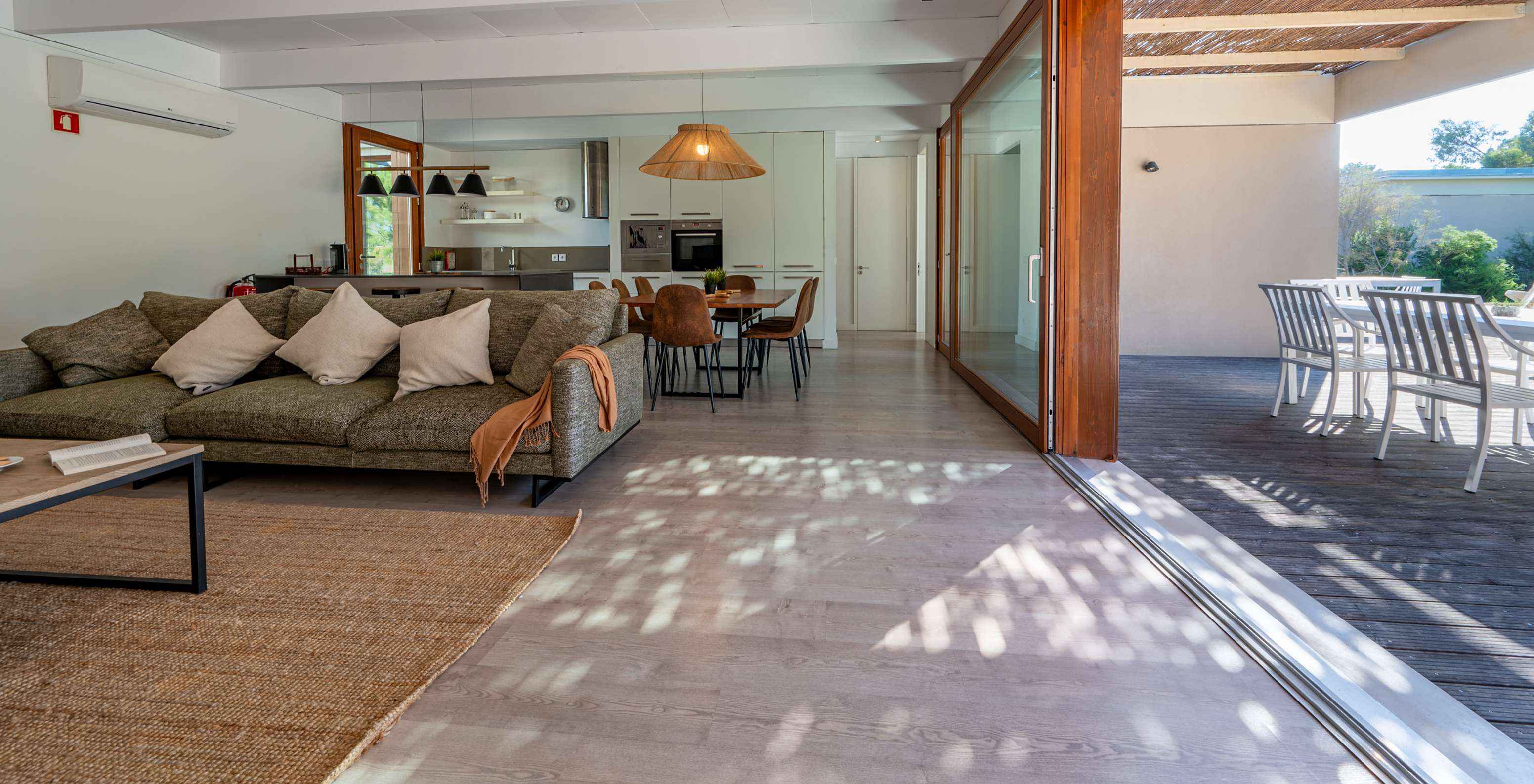 The Beach Villa with Private Pool of Pestana Tróia Eco Resort has a living room connected to the kitchen and a terrace