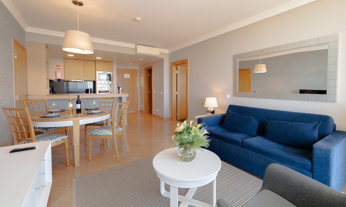 The Superior 1 Bedroom Apartment at Pestana Alvor Park has a living room with a sofa, lamps, and mirrors