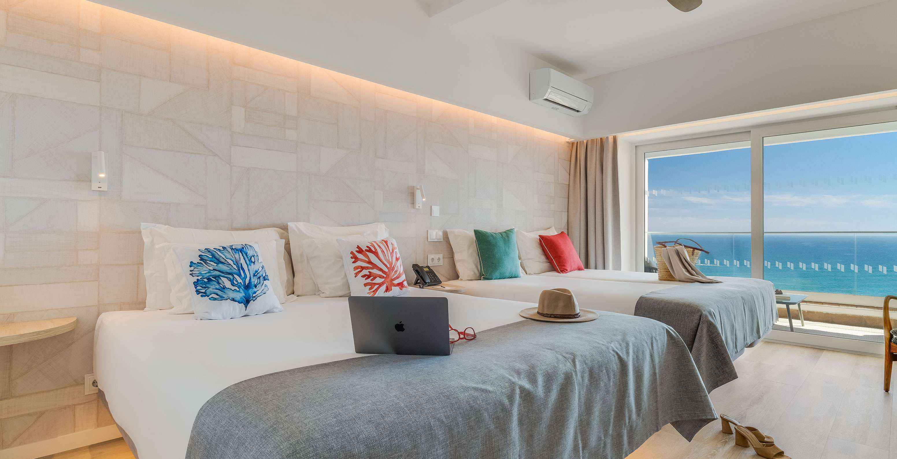 The Superior Family Sea View Room at Pestana Blue Alvor Beach has two double beds, air conditioning, and a balcony with view