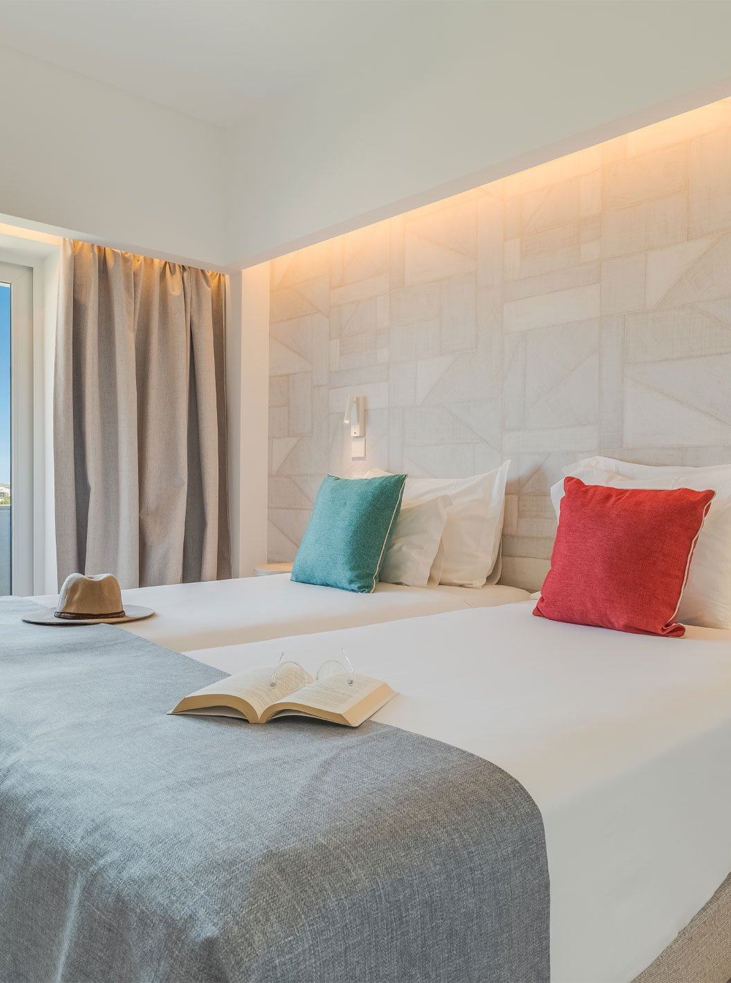 The Classic Garden View Room at Pestana Blue Alvor Beach has two beds with white sheets and colorful pillows