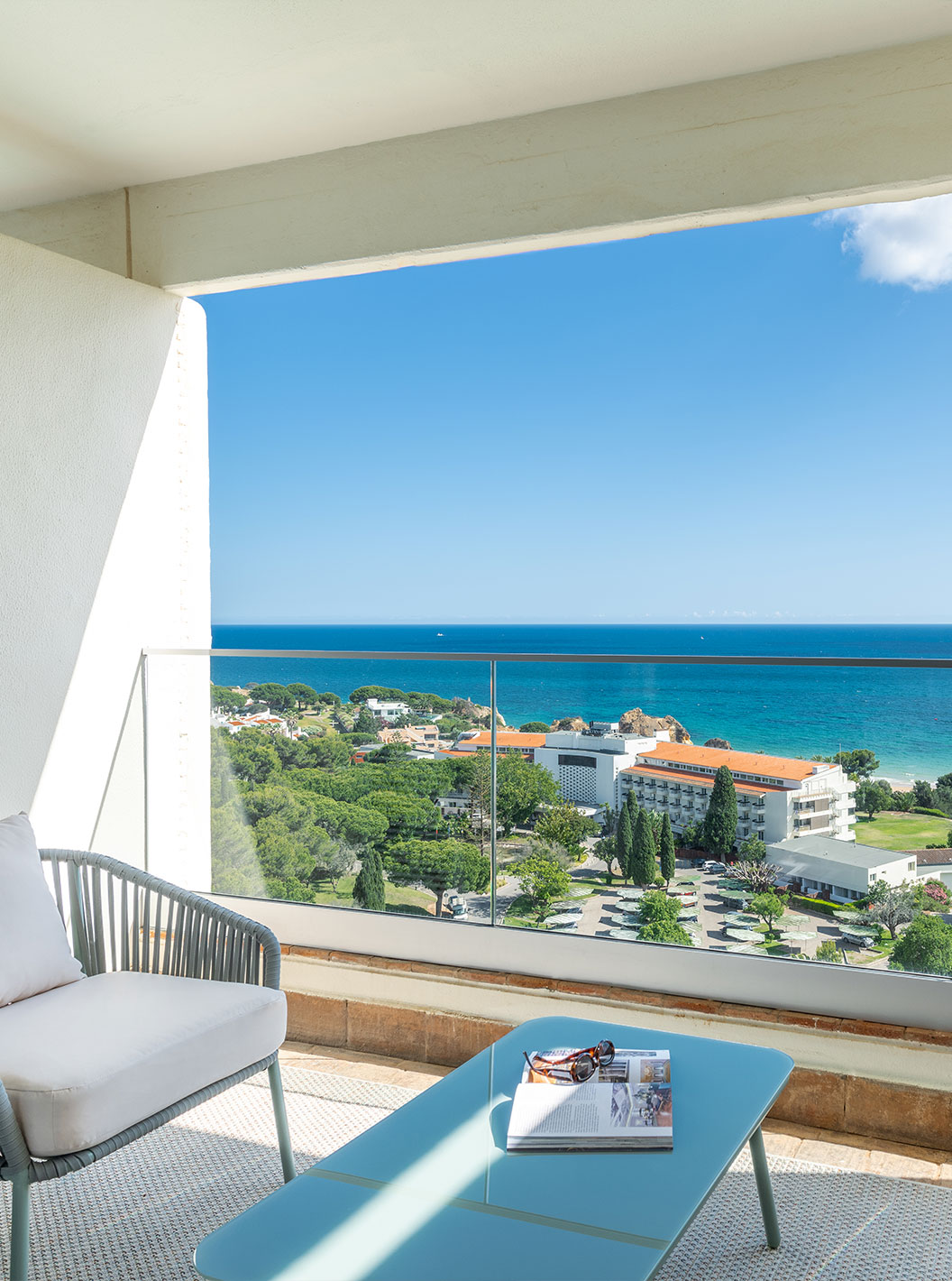 The Superior Family Sea View Room at Pestana Blue Alvor Beach has a balcony with a table and two chairs, and a sea view