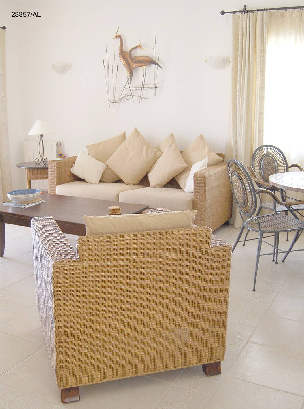 The Pestana Carvoeiro Golf T2 Standard Apartment has a living room with a sofa, armchairs, and dining table