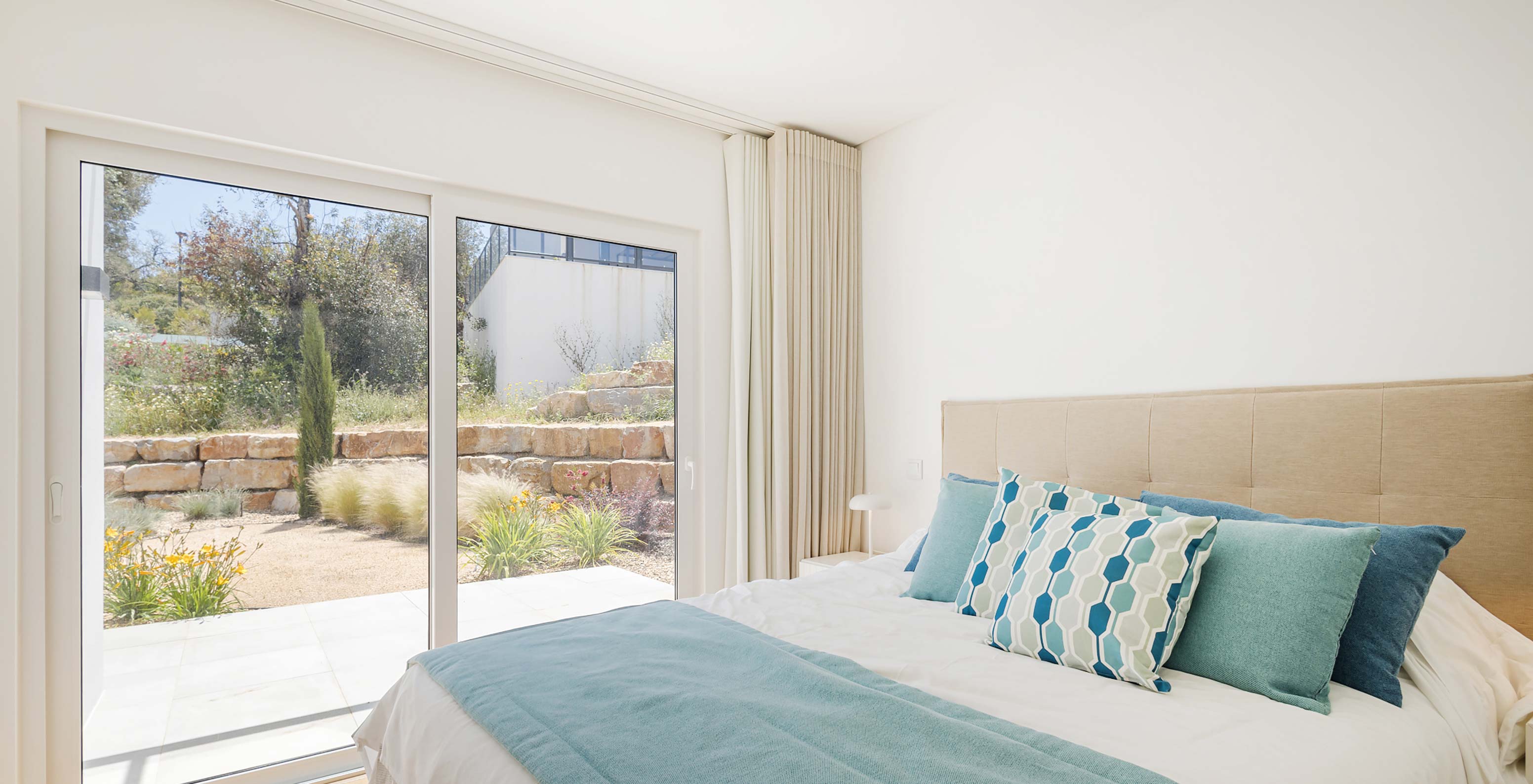 Pestana Valley Nature Village villa with a bed with an outdoor view