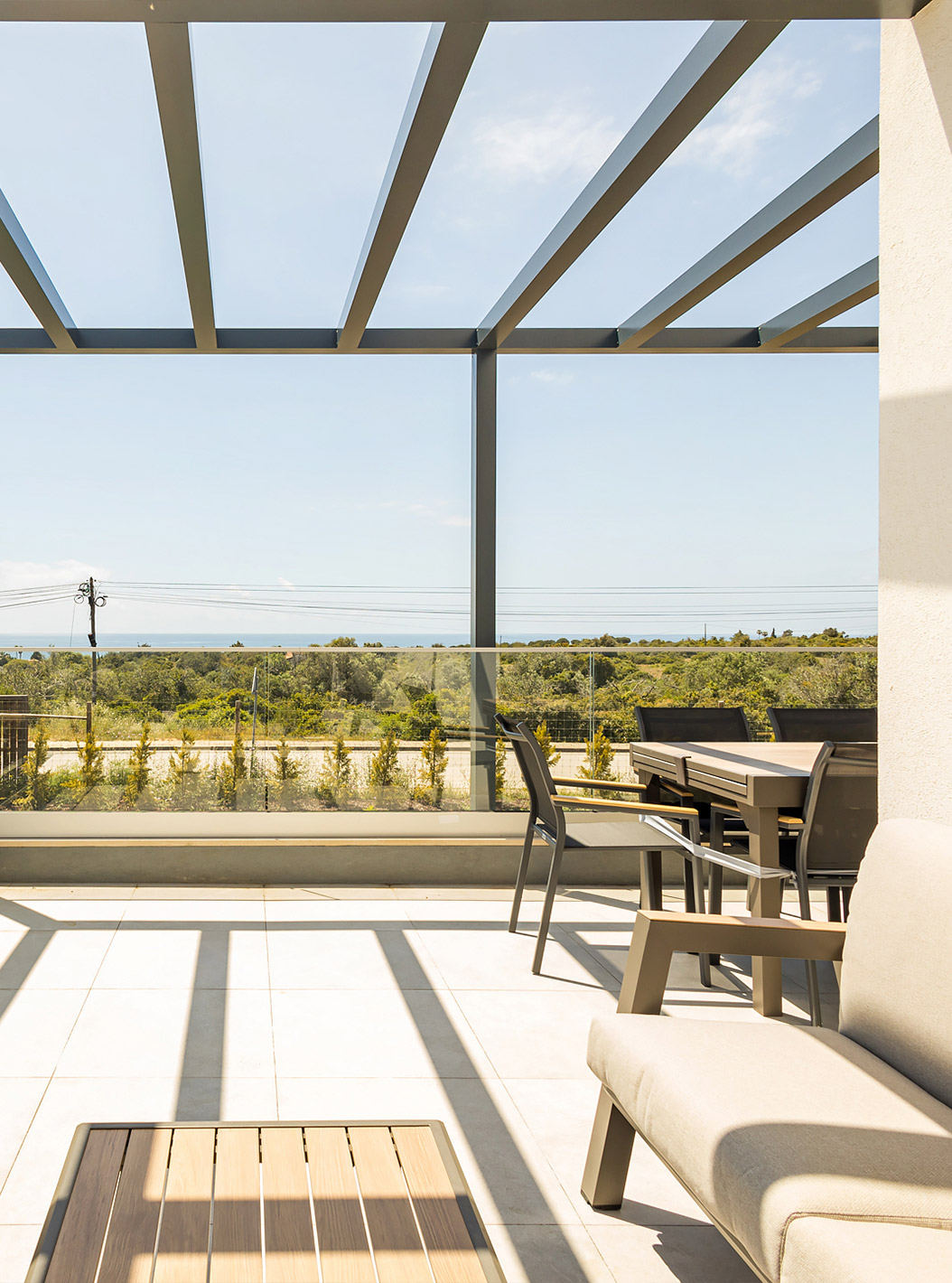 The First Floor 2 Bedroom Apartment at Pestana Valley Nature Village has a terrace with sofas and a dining table