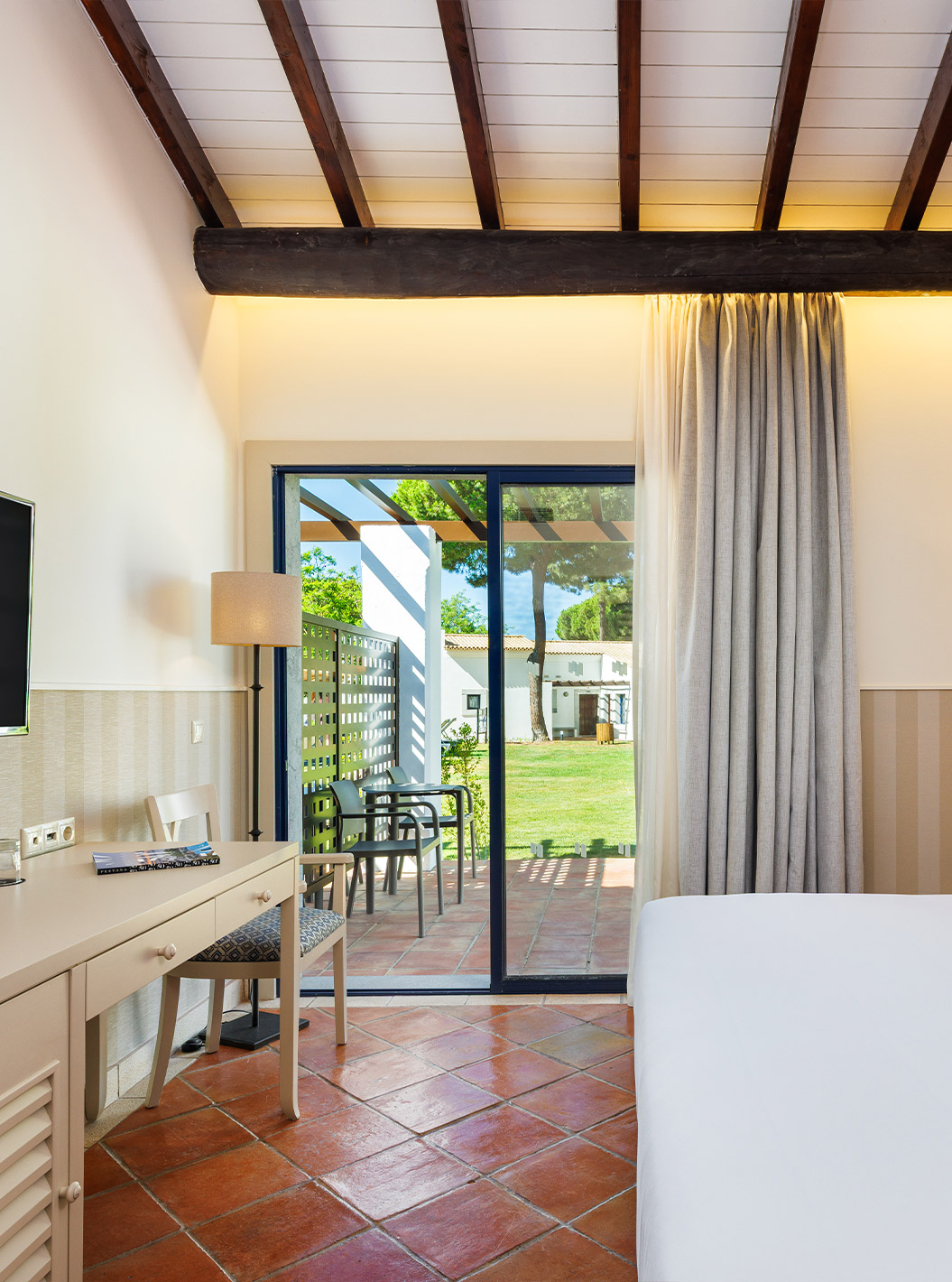 The Superior Garden View at Pestana Vila Sol - Vilamoura has a double bed, TV and window with balcony access