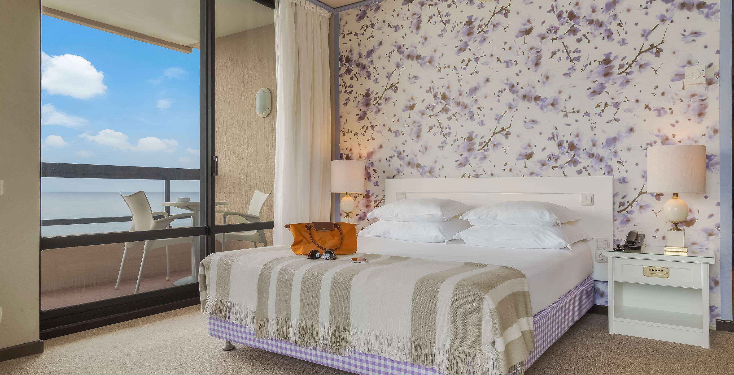 Standard Sea View room at Pestana Bahia Praia has a double bed, with 4 pillows and a balcony with sea view