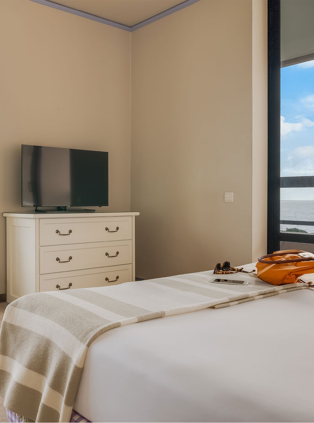 Standard Sea View room at Pestana Bahia Praia has two windows, both with sea views and part of the island's green landscape