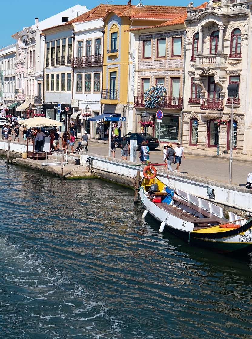Ride on the historic moliceiros boats through the canals of Aveiro in Portugal