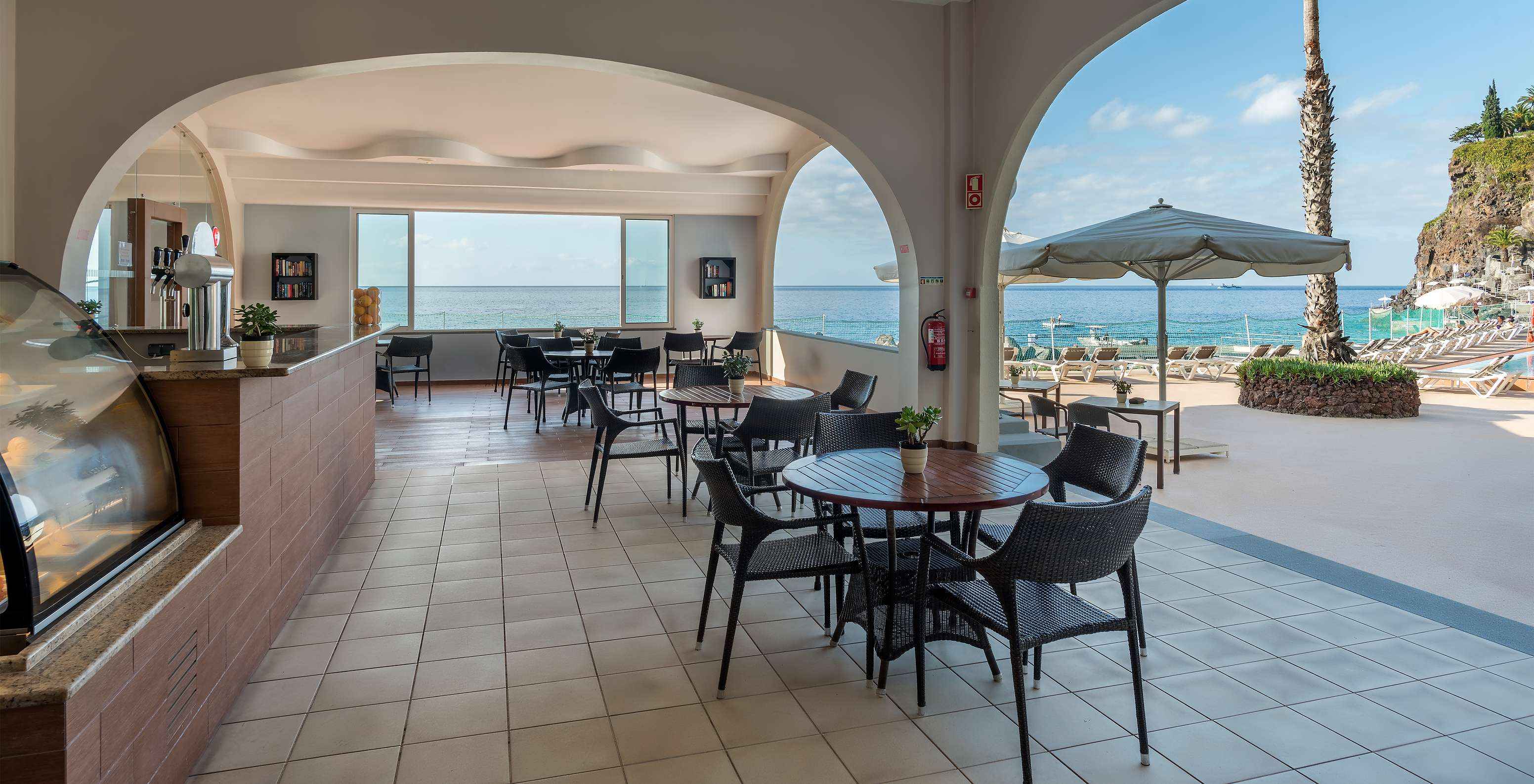 The Atlântico bar at the hotel in central Funchal, Madeira, has both indoor and outdoor terraces with sea views