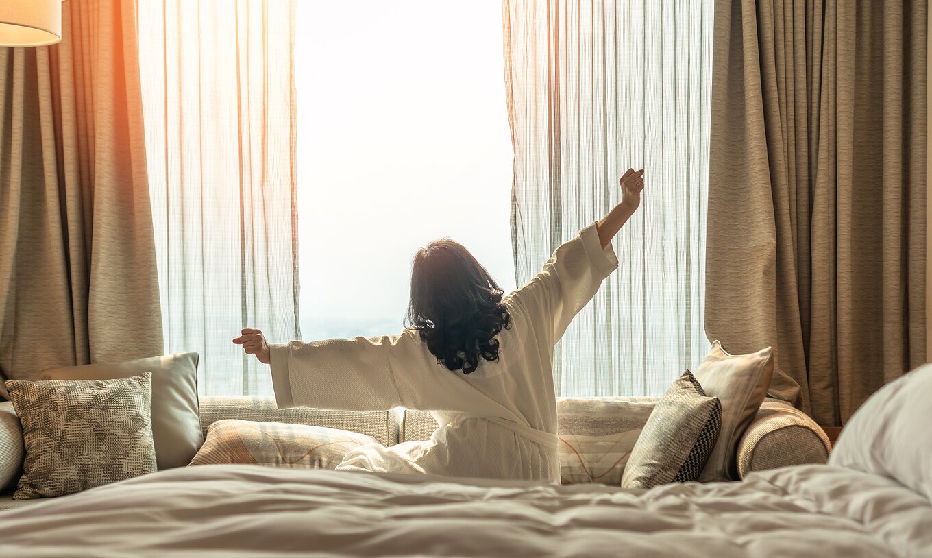 The T1 Apartment at Pestana Madeira Beach Club has a large window with beige curtains, a sofa and a double bed