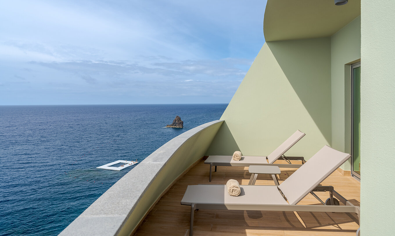 The Superior Sea View Suite at Pestana Vila Lido Madeira features a balcony with two sun loungers and sea view