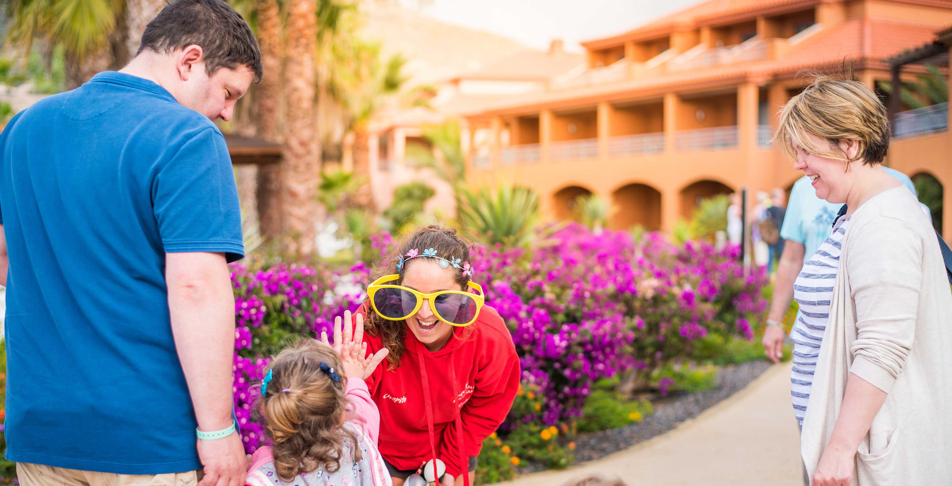 Family fun at Pestana Porto Santo, big sunglasses, purple flowers on a sunny day