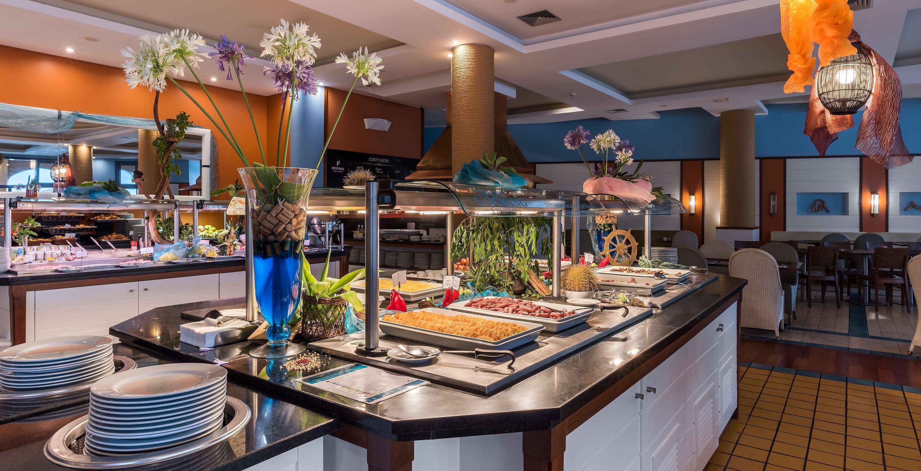 The Marés restaurant at the 5-Star Resort in Porto Santo features a buffet with options like yogurt, fruit, and bread