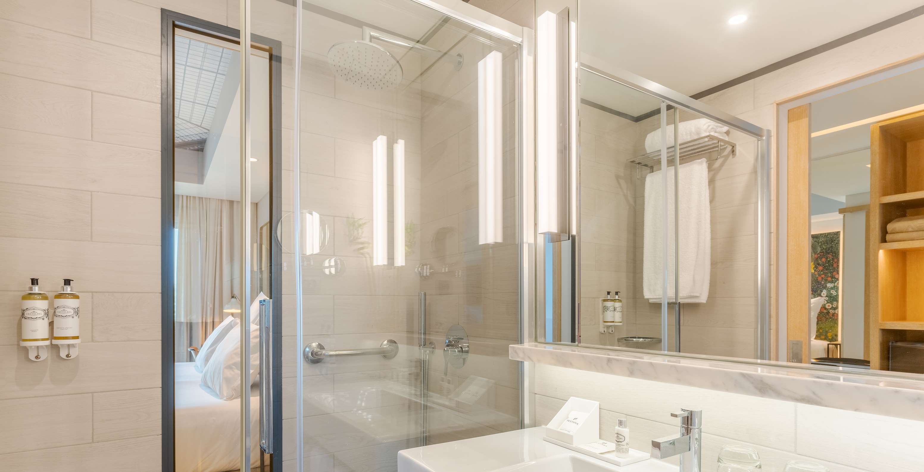 The Superior room at Pestana Douro Riverside features a bathroom with a sink, mirror, and shower