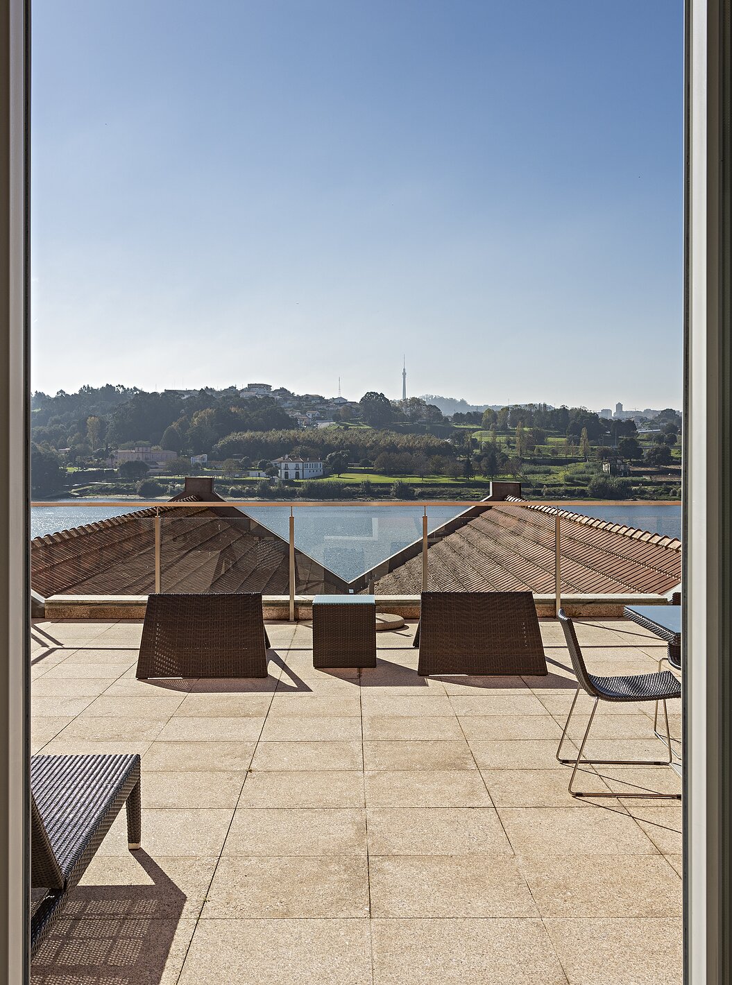 The Suite Nasoni has a large balcony with two tables, chairs, and a sun lounger