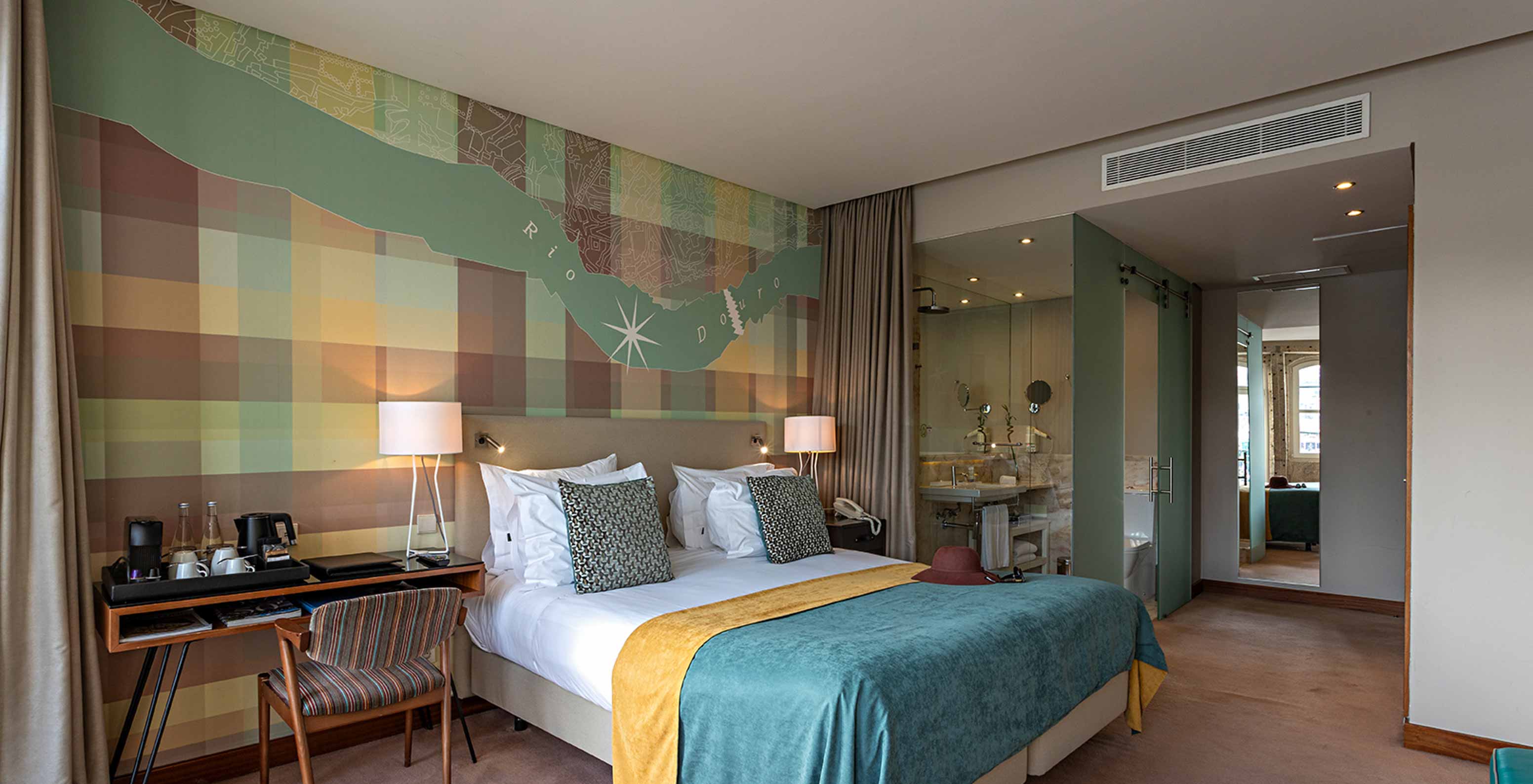 The Vintage River View Balcony at Pestana Vintage Porto has a double bed, a desk and a view of the interior of the bathroom