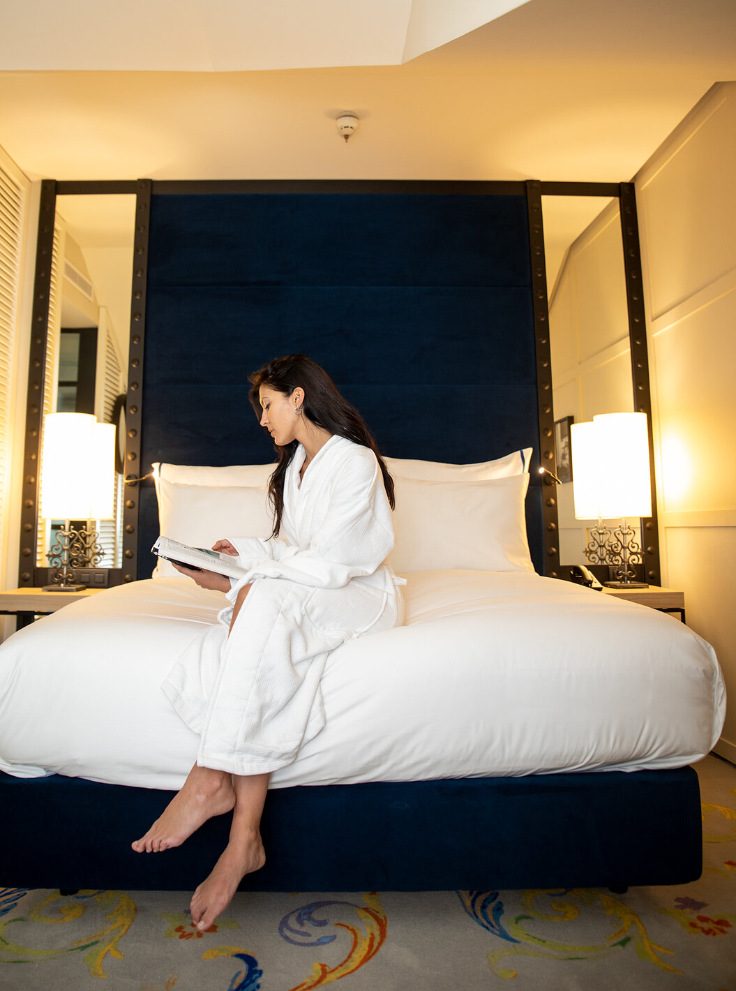 Superior Room at Pestana Plaza Mayor Madrid has a bed with two bedside tables and two mirrors