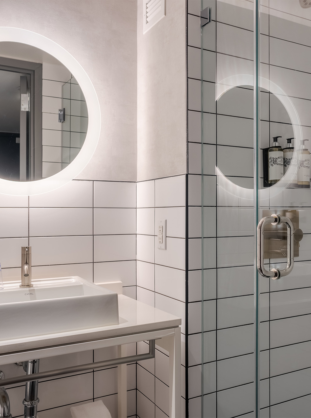 The Comfort Double at Pestana CR7 Times Square has a bathroom with shower, sink, and a mirror