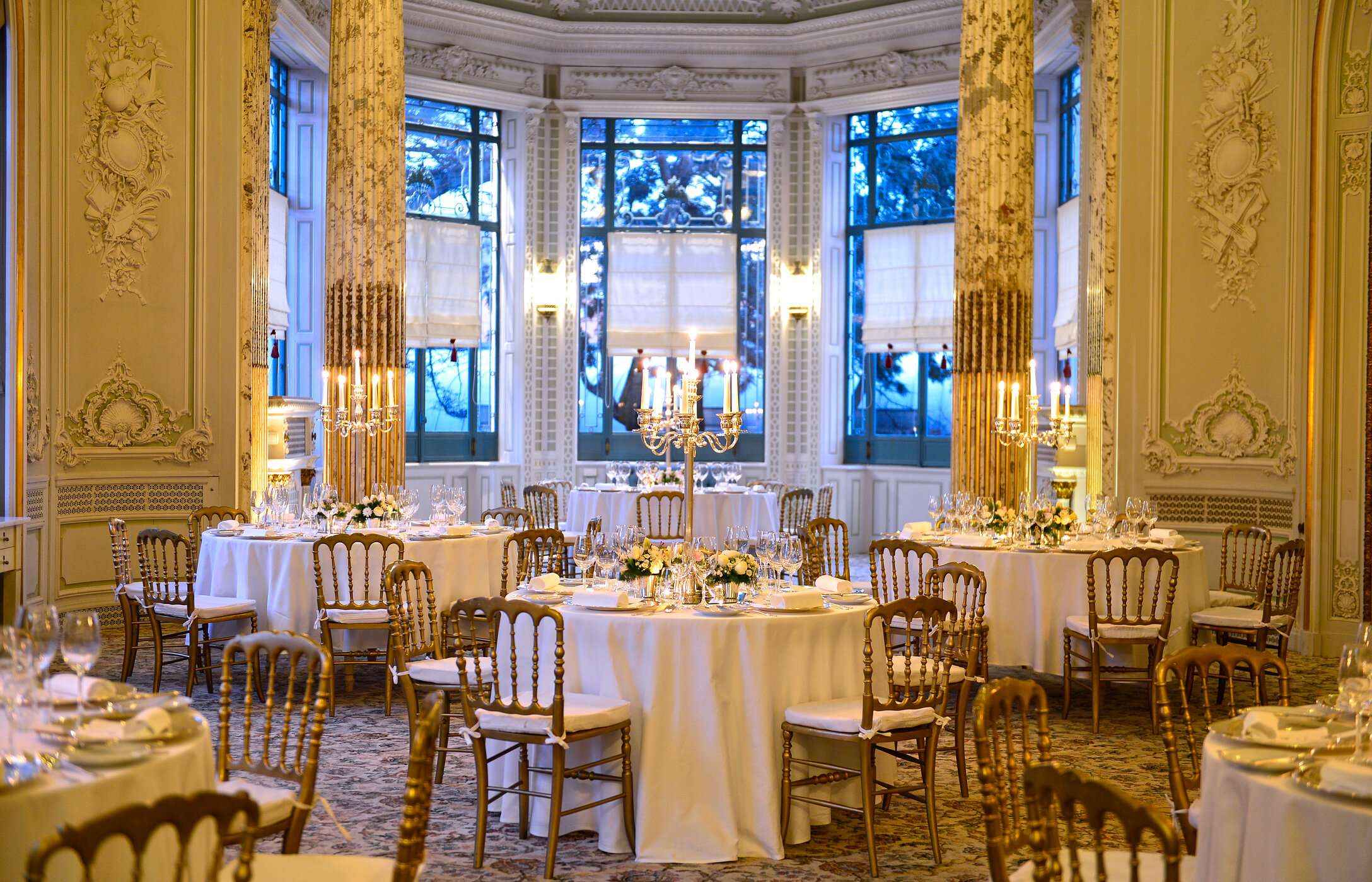 Celebrate at Pestana Hotel Group in elegant venues with tables, floral arrangements, and candelabras