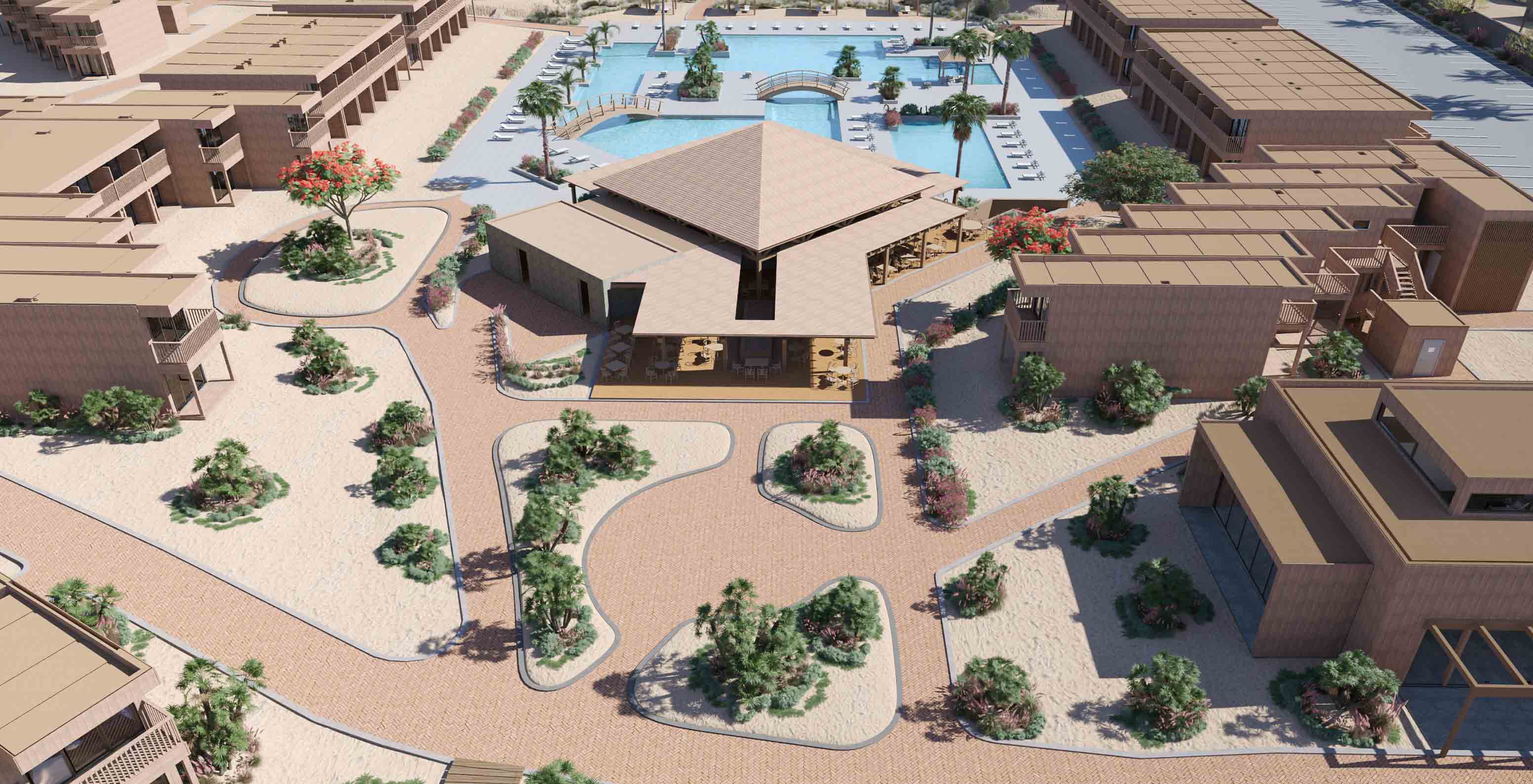 Vista aérea das instalações do Pestana Dunas Porto Santo com piscina, jardins e edifícios em tons de areia