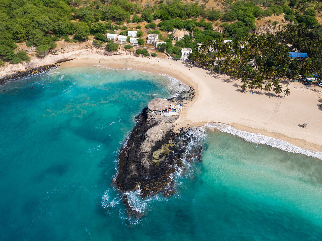 The blue of the Atlantic Ocean contrasting with the lush, rocky nature of Praia City in Cape Verde