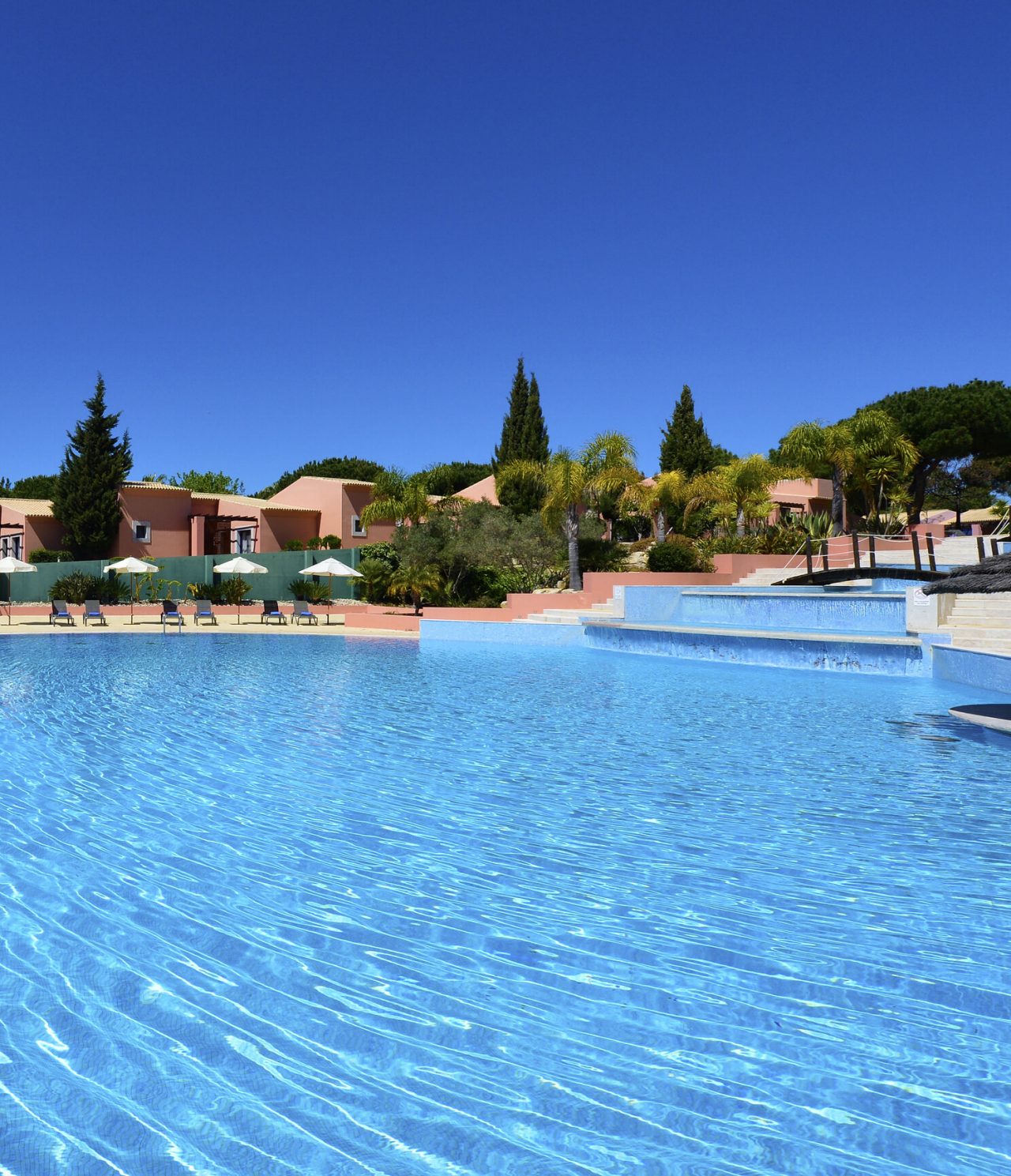 The Pool Bar, at the 5-Star Hotel in Vilamoura, is next to the pool with several lounge chairs