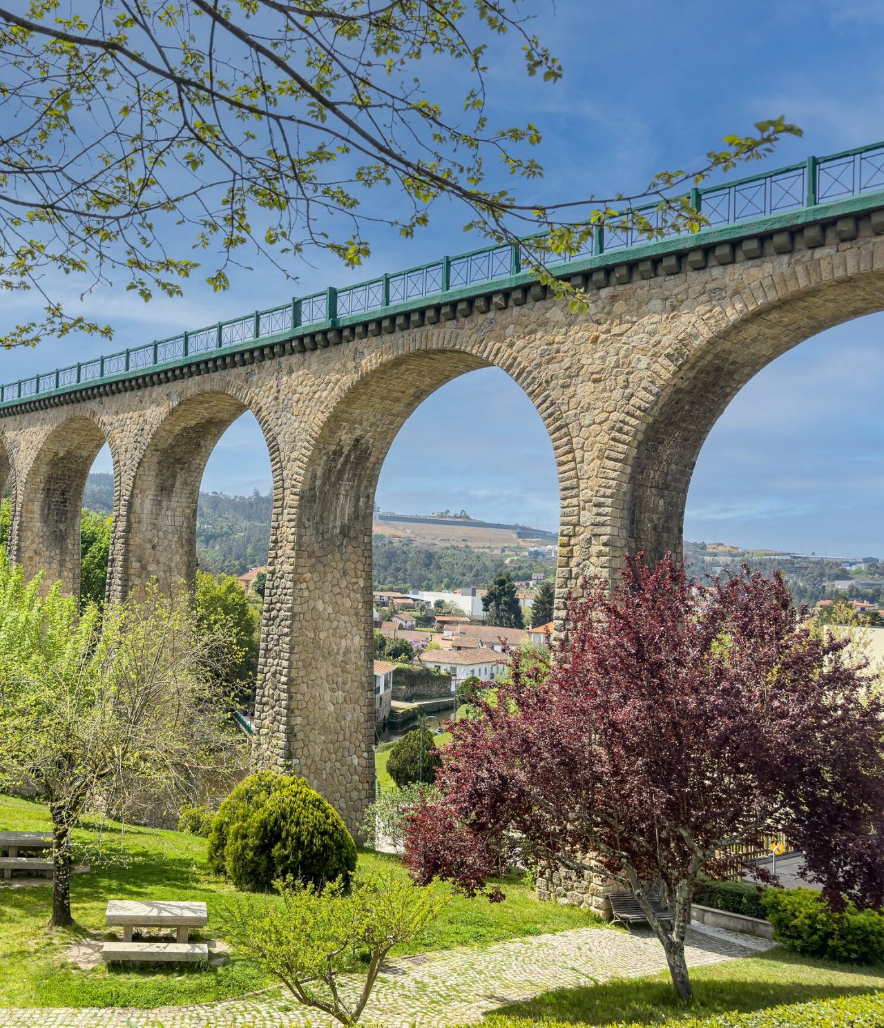 Architectural beauty of an aqueduct standing out against the green backdrop of nature