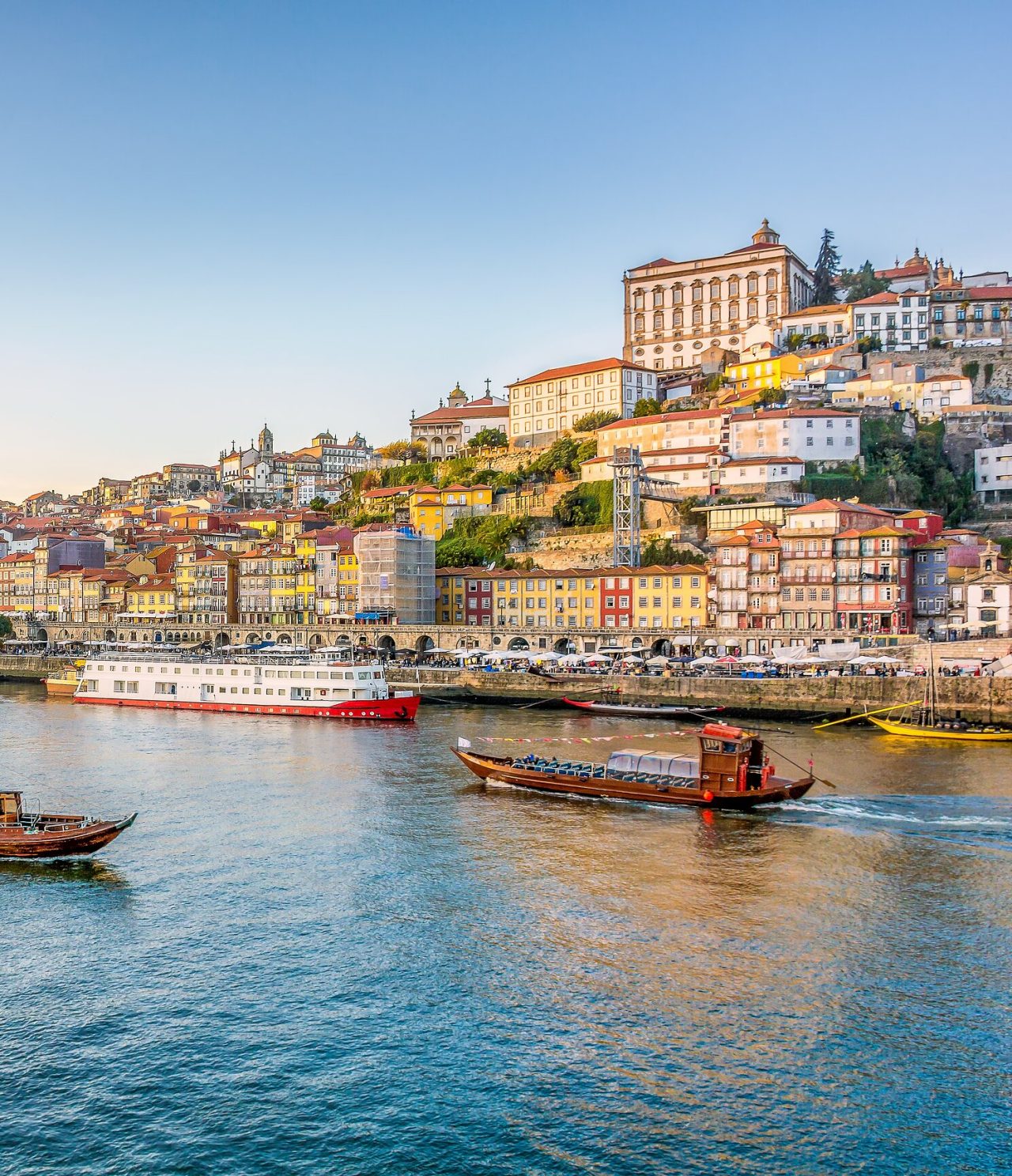 Panoramic view of Porto's Ribeira and the Douro River, with the characteristic colorful buildings of Porto in the background