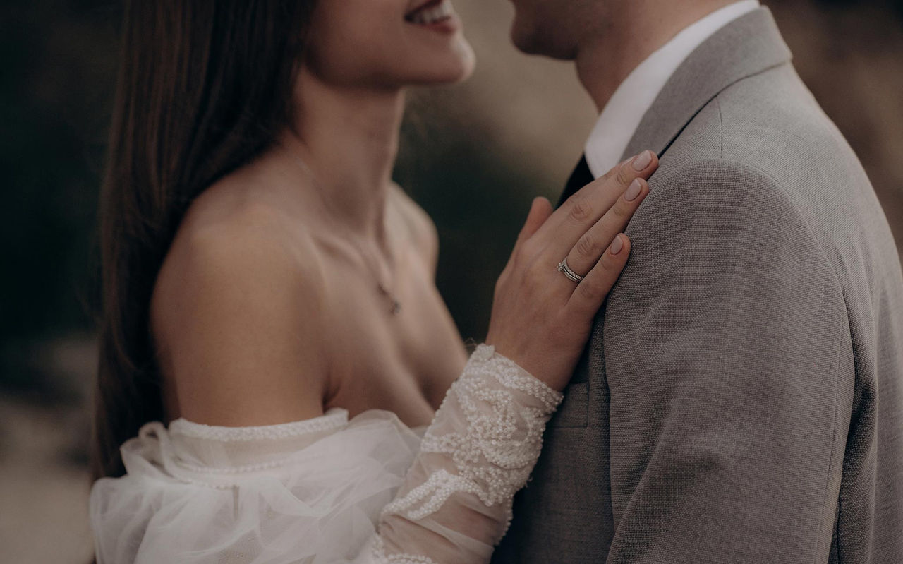 Smiling couple celebrates their wedding at Pestana Hotel Group, in a special venue with personalized decor